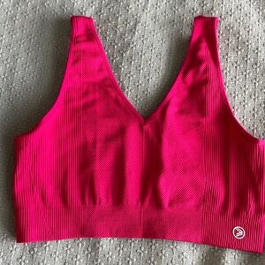 Raspberry color bra top large but runs like medium. Soft removable pads